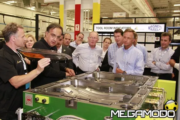 grand opening guests viewing magneti marelli production technologies